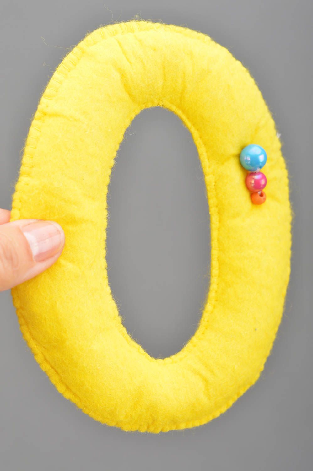 Handmade small soft toy letter O sewn of felt yellow for interior decoration  photo 3