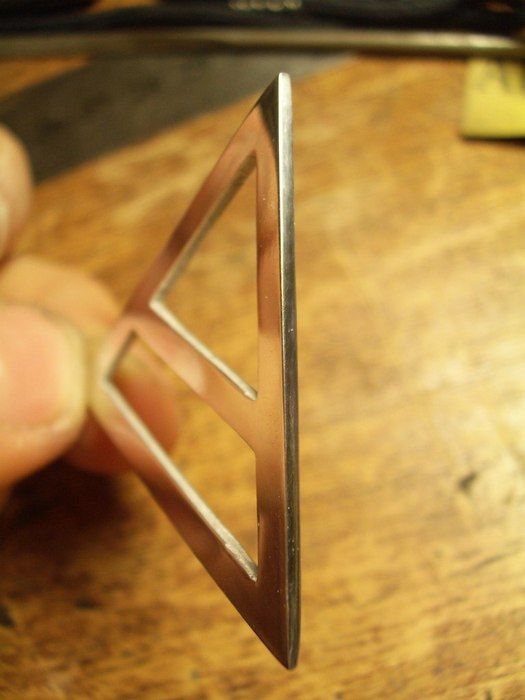 Triangular metal pendant Triada photo 1