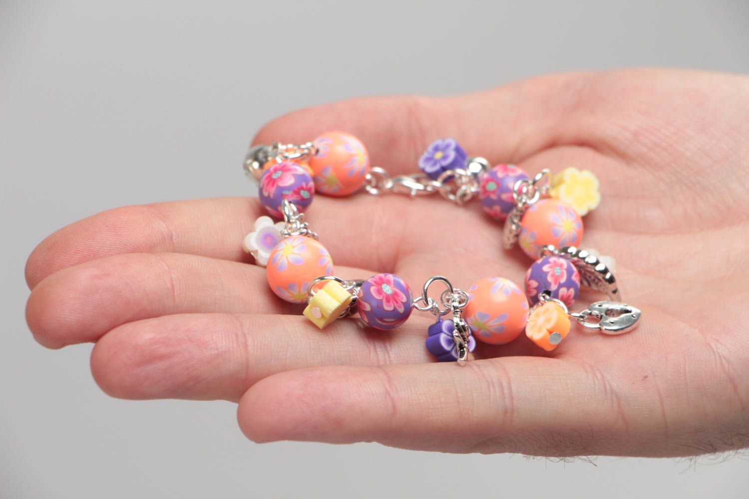 Unusual colorful handmade children's plastic wrist bracelet with charms photo 5