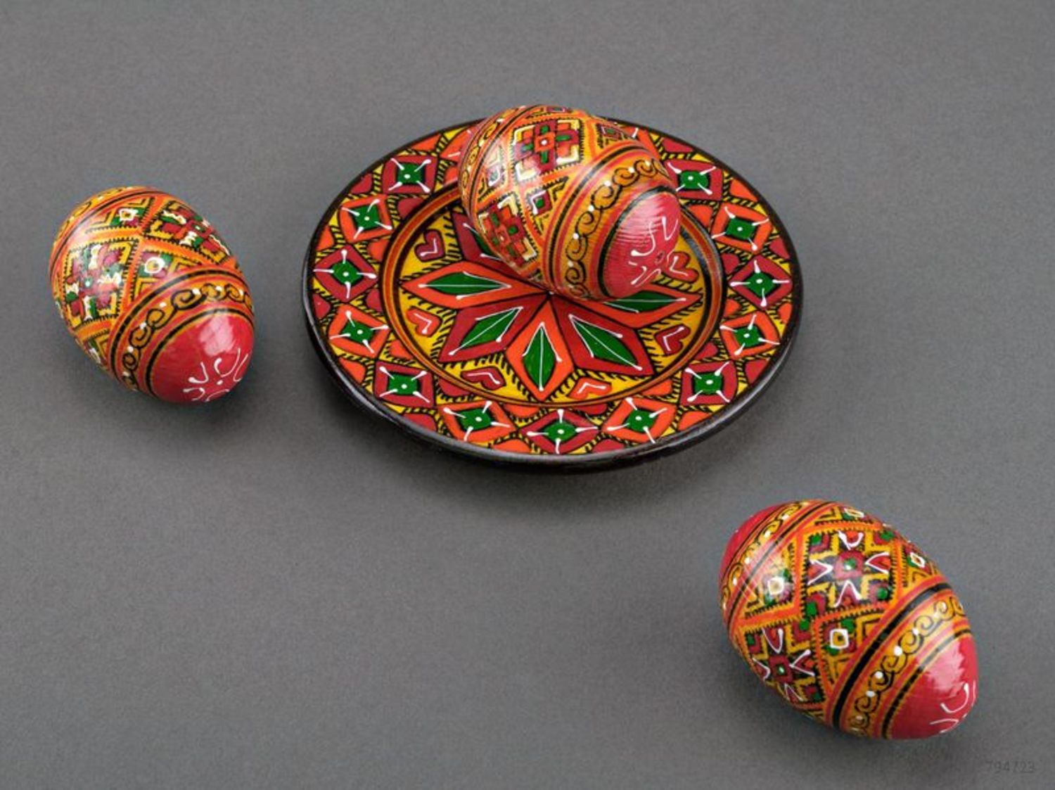 Wooden painted eggs on the plate photo 5
