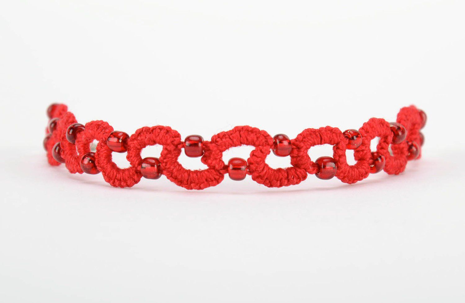 Red bracelet made from cotton threads photo 3