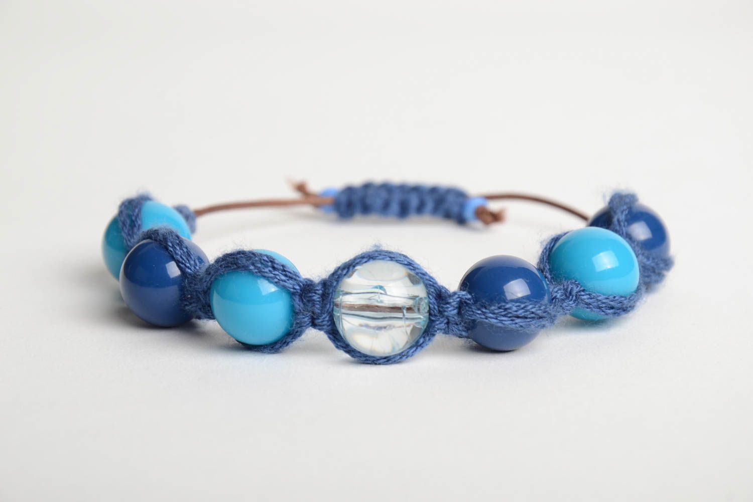 Handmade wrist bracelet crocheted of cord and plastic beads in blue color shades photo 4