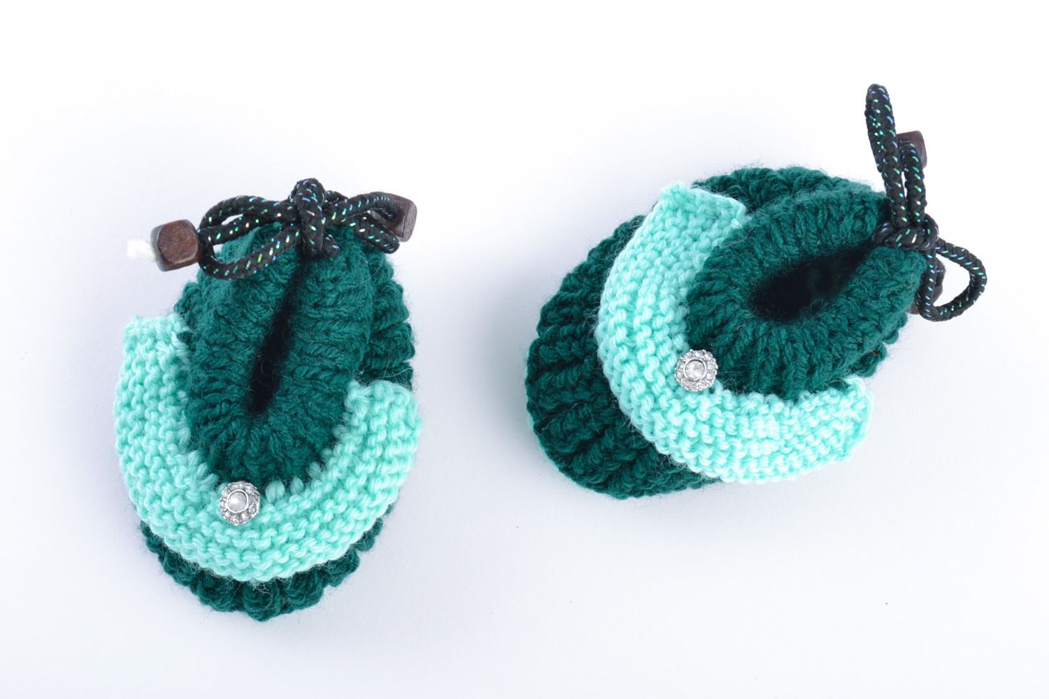 Hand knitted wool baby booties of green color photo 2