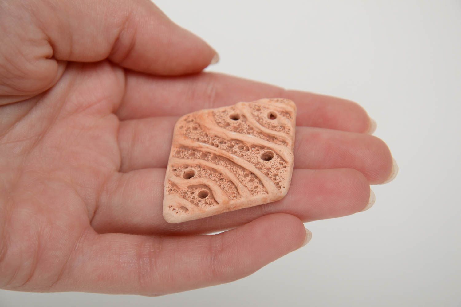 Homemade craft blank in the shape of pendant molded of clay of beige color photo 5