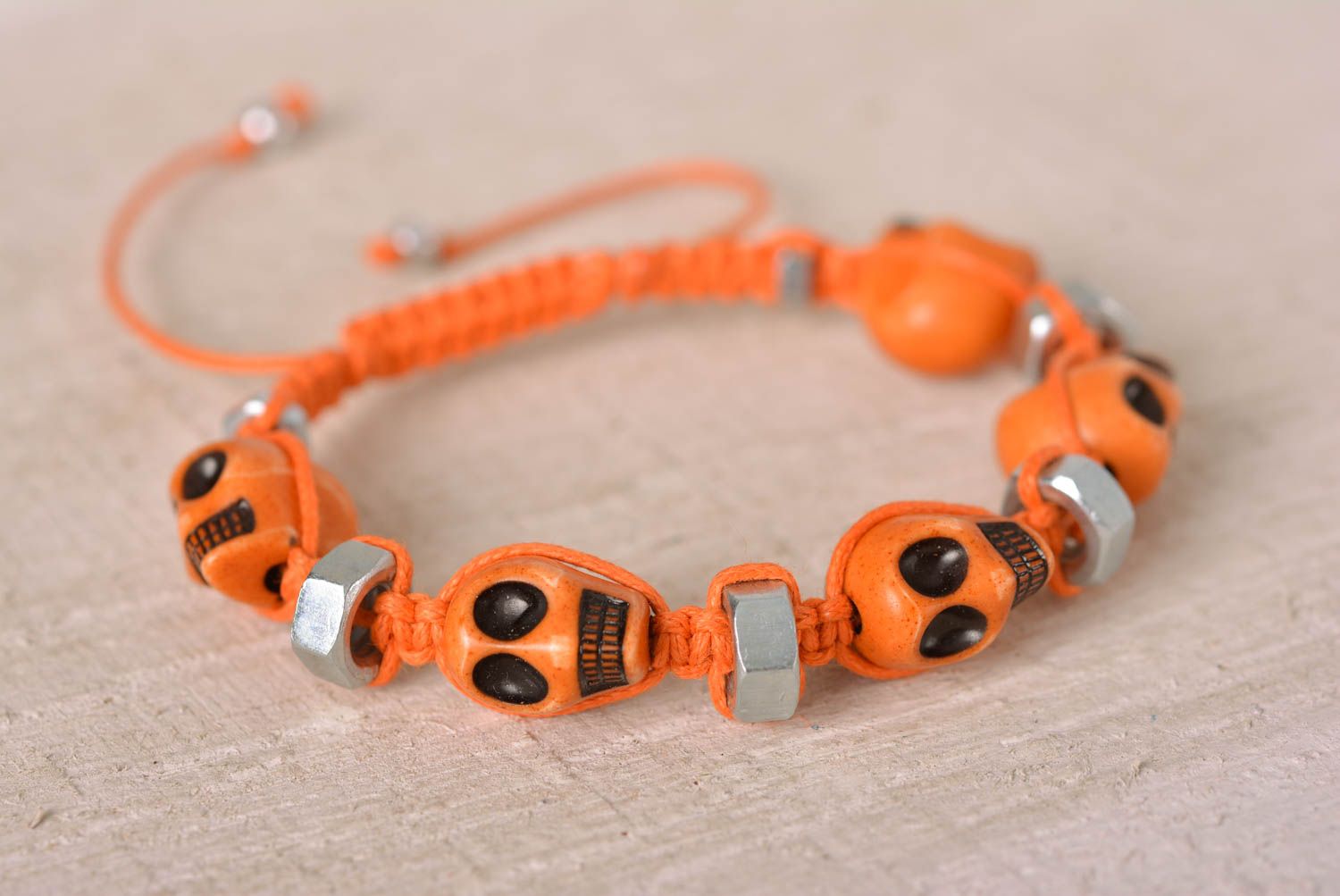 Handmade orange skull beaded orange cord bracelet with female screws photo 1