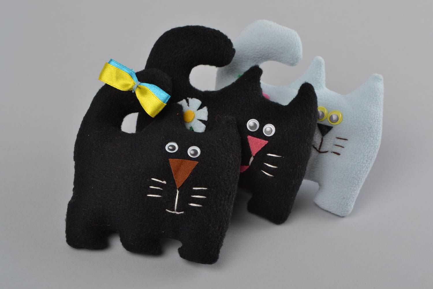 Handmade black soft toy cat made of fleece with colorful bow photo 1