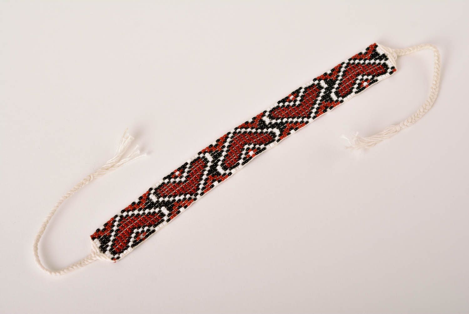 Handmade beaded bracelet with Ukrainian style ornament in red, black, and white color photo 4