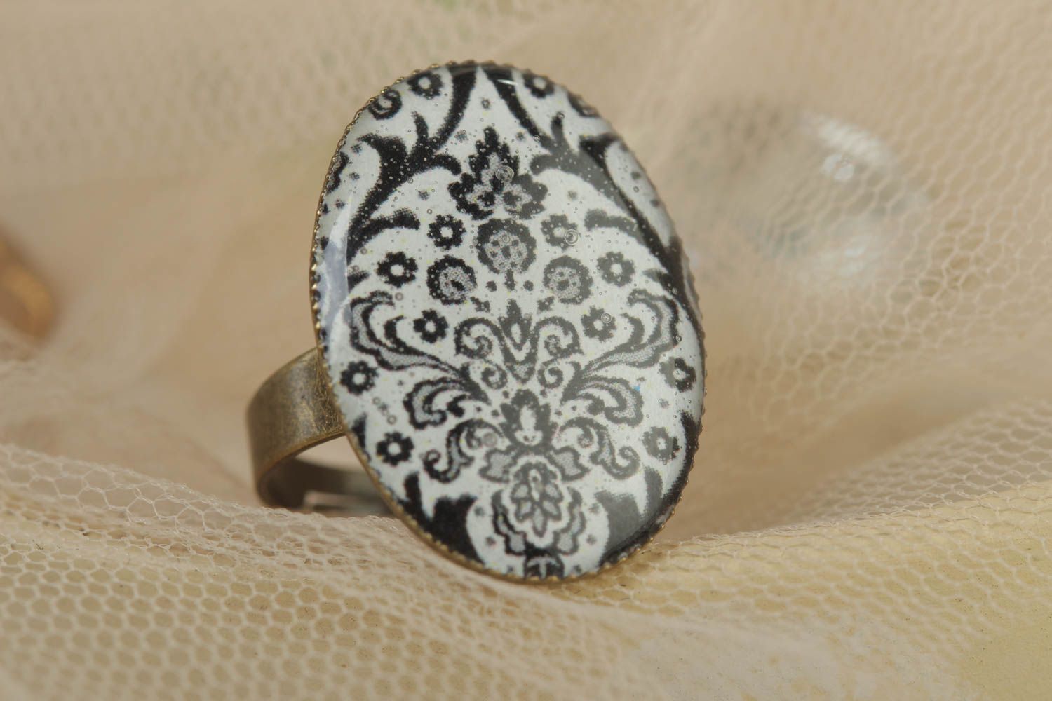 Handmade oval glass glaze ring with metal basis and black and white pattern photo 1