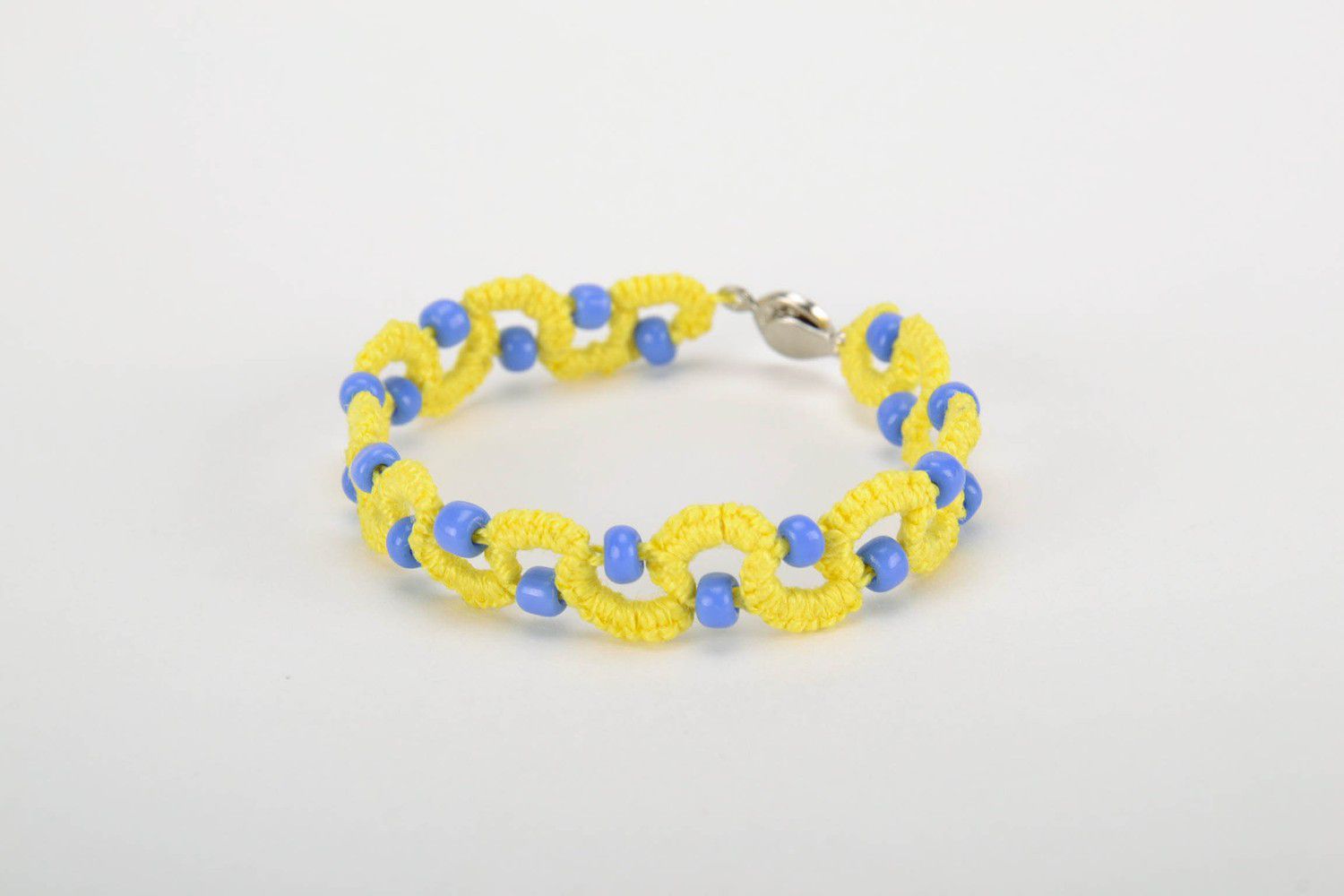 Yellow and blue bracelet made from cotton threads photo 1