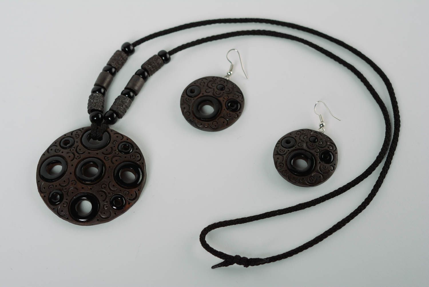 A set of handcrafted black ceramic earrings and necklace made of clay with colored enamel paintings photo 1