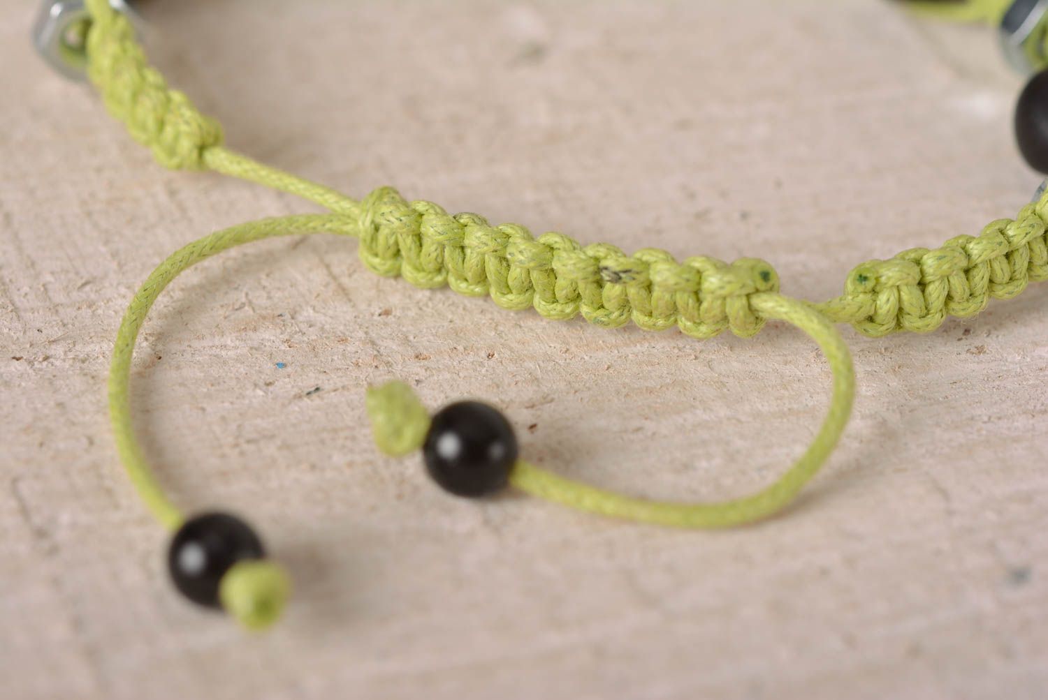 Handmade black skull color beads on light green cord bracelet with female screws photo 4