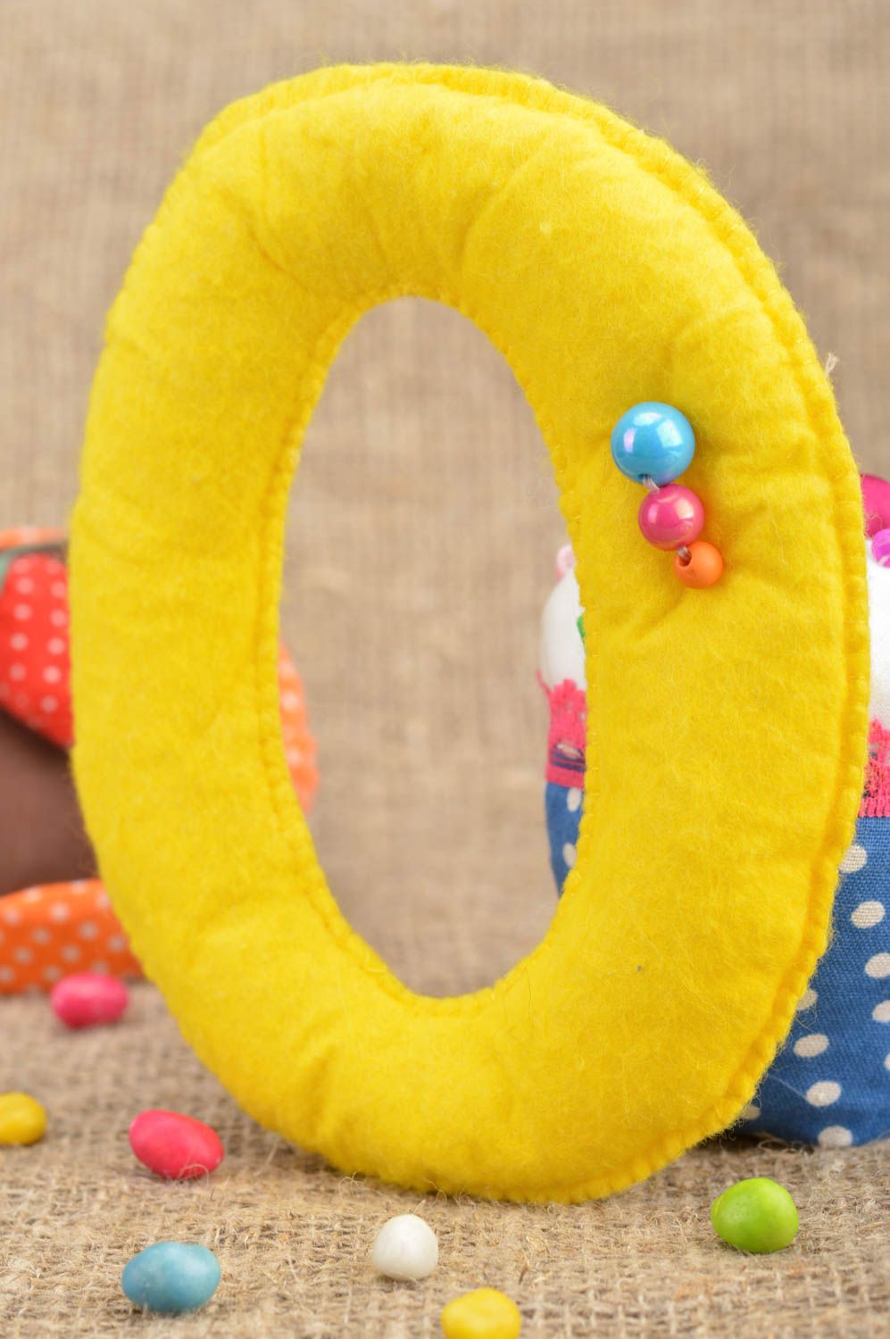 Handmade small soft toy letter O sewn of felt yellow for interior decoration  photo 1