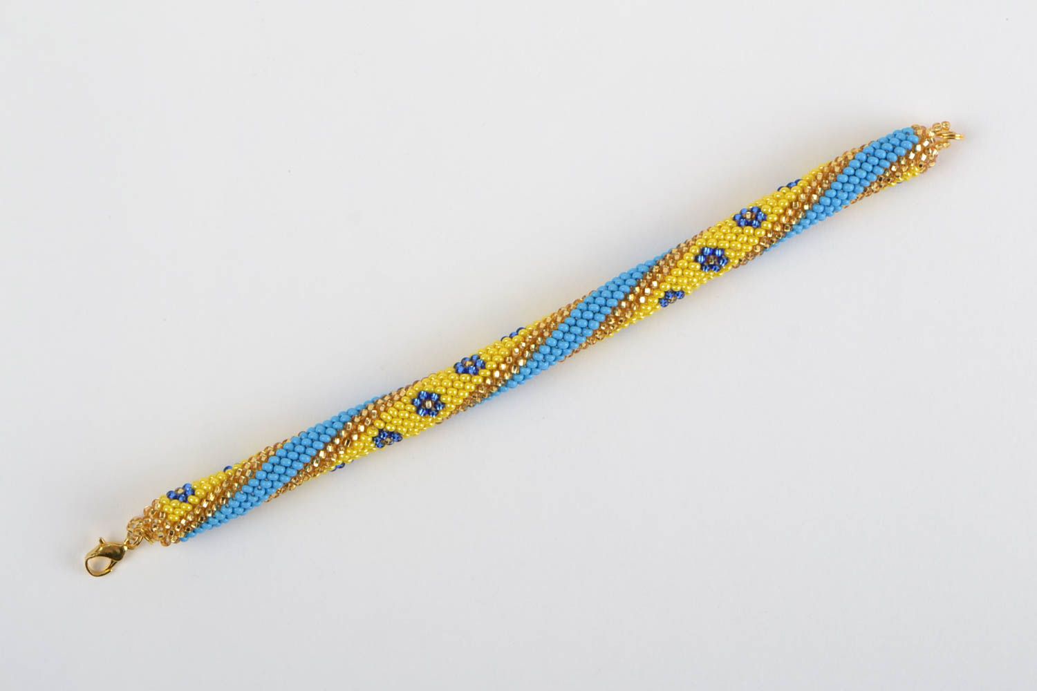 Наручный браслет из бисера ручной работы в виде жгута желтый с голубым фото 2