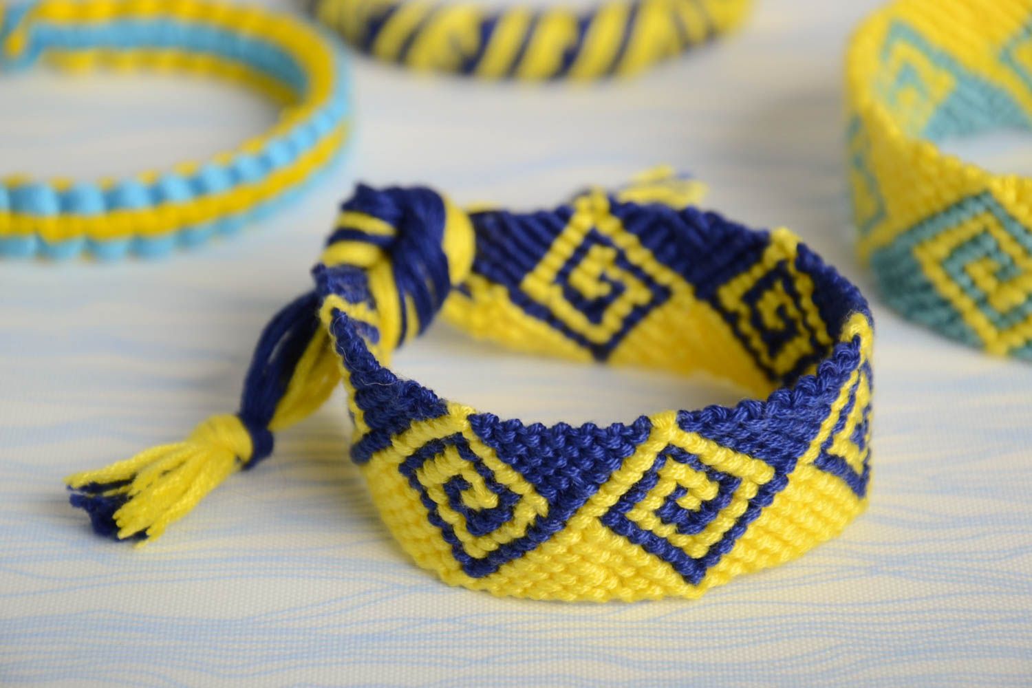 Handmade wide friendship wrist bracelet woven of yellow and blue embroidery floss photo 1