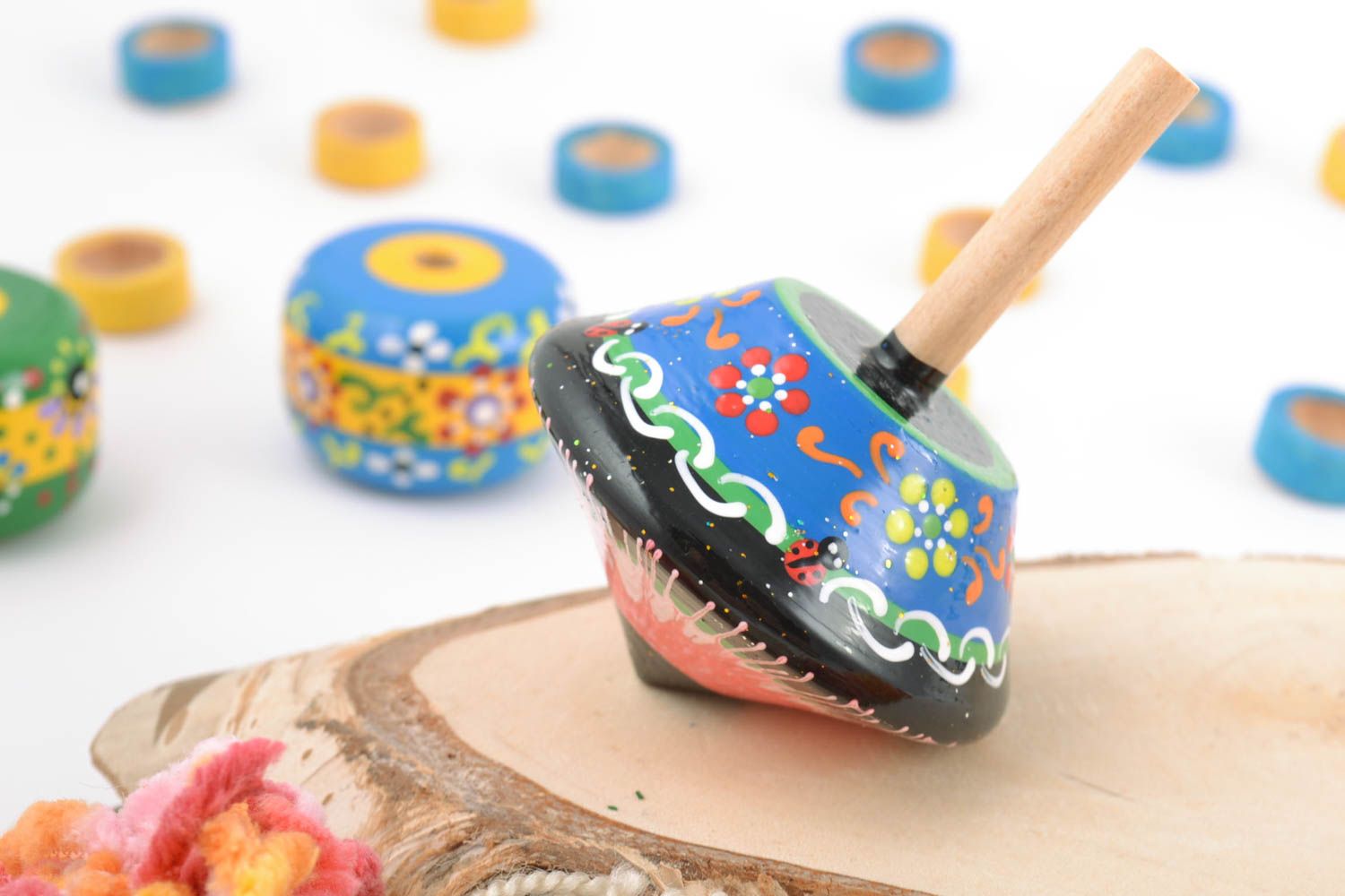 Handmade small blue wooden spinning top toy painted with eco dyes for children photo 1