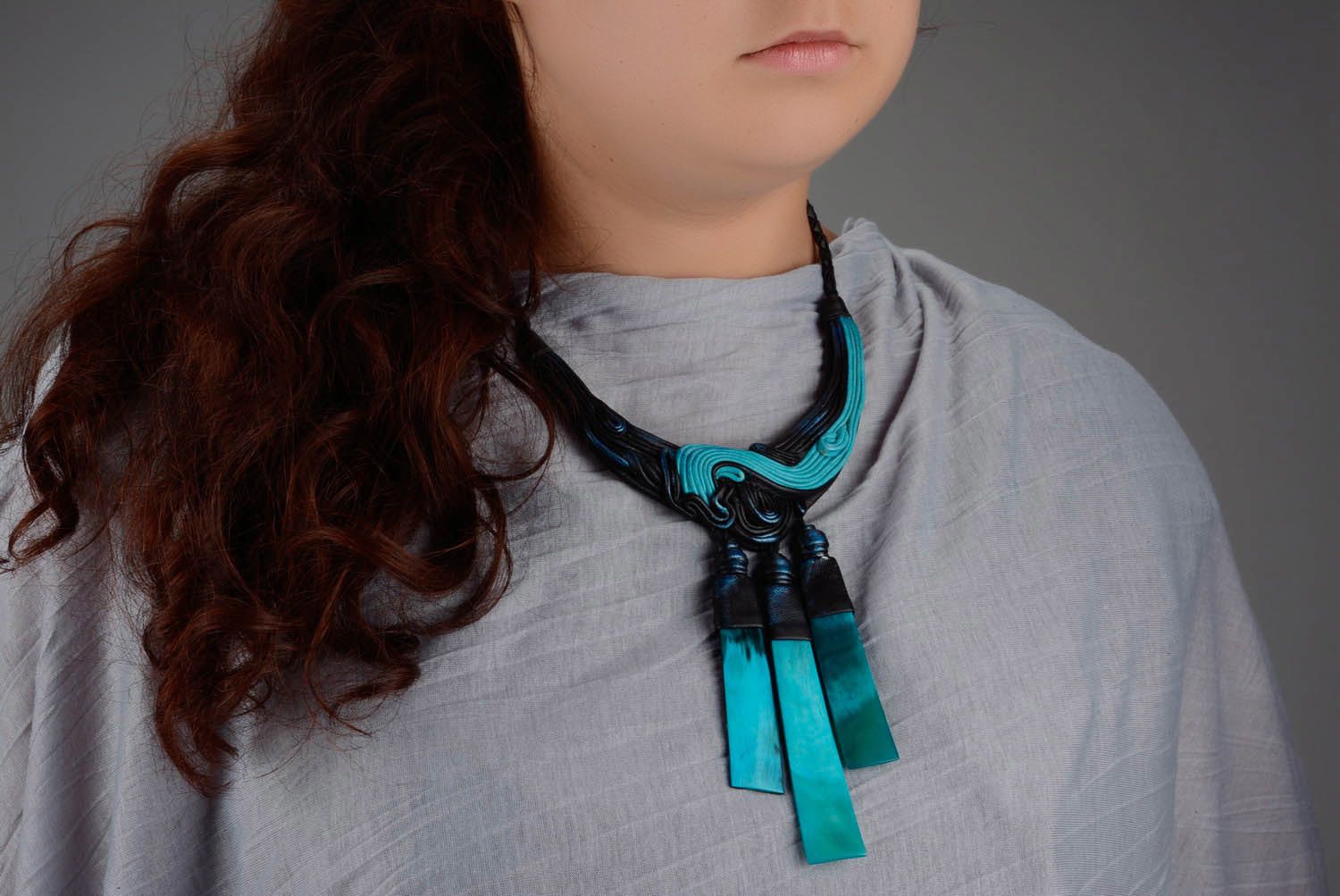 Leather necklace with cow horn photo 4