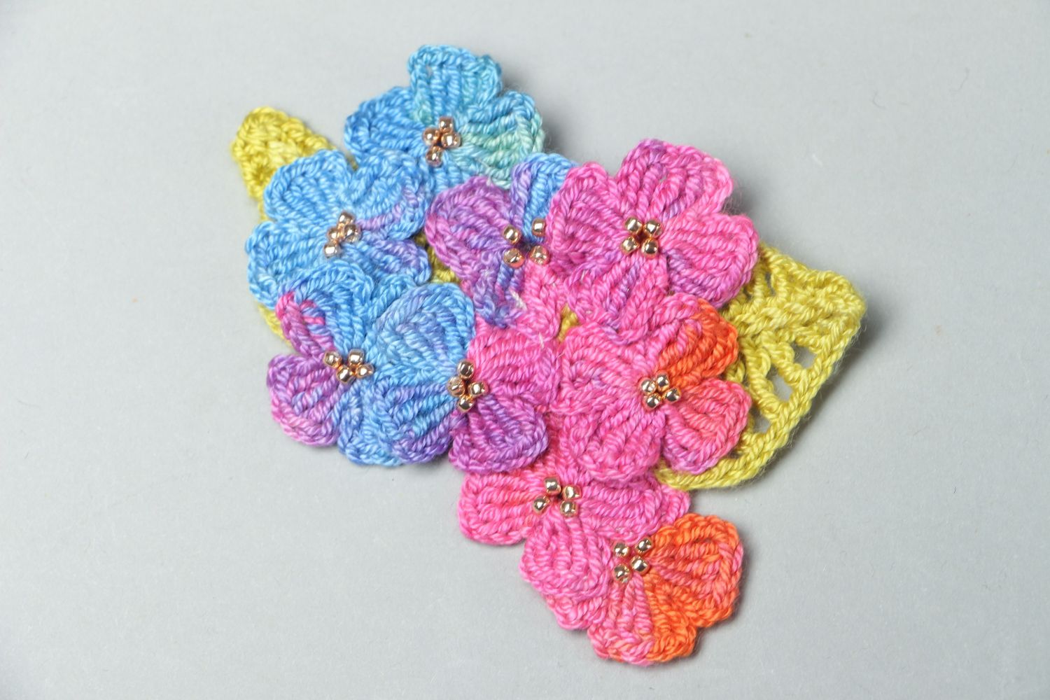 Multi-colored crochet flower brooch photo 1