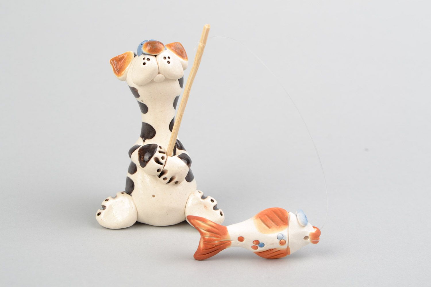 Handmade designer ceramic figurine painted with colorful glaze Cat Fisherman photo 1