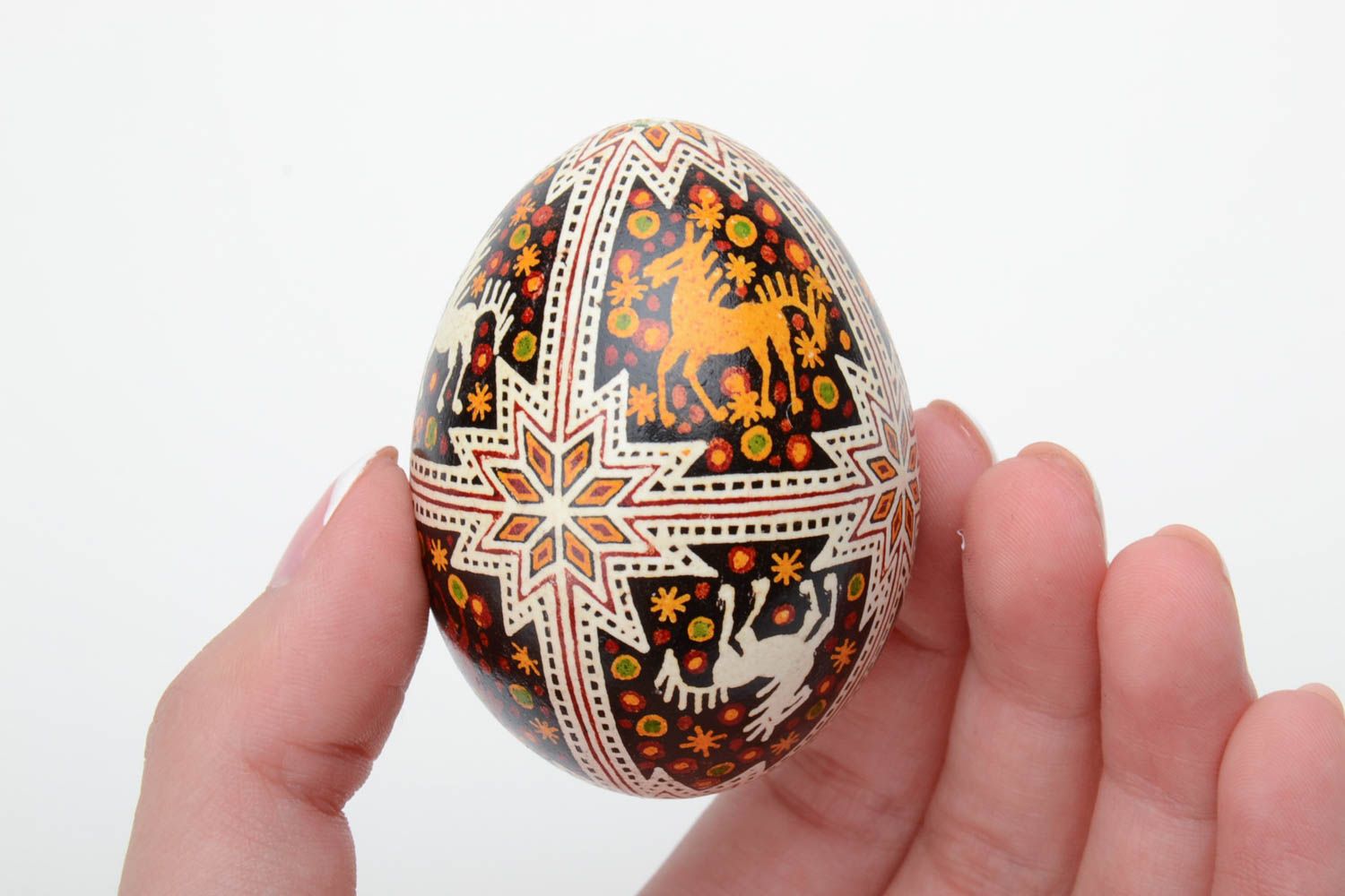 Festive handmade painted Easter egg with special symbol waxing technique photo 5