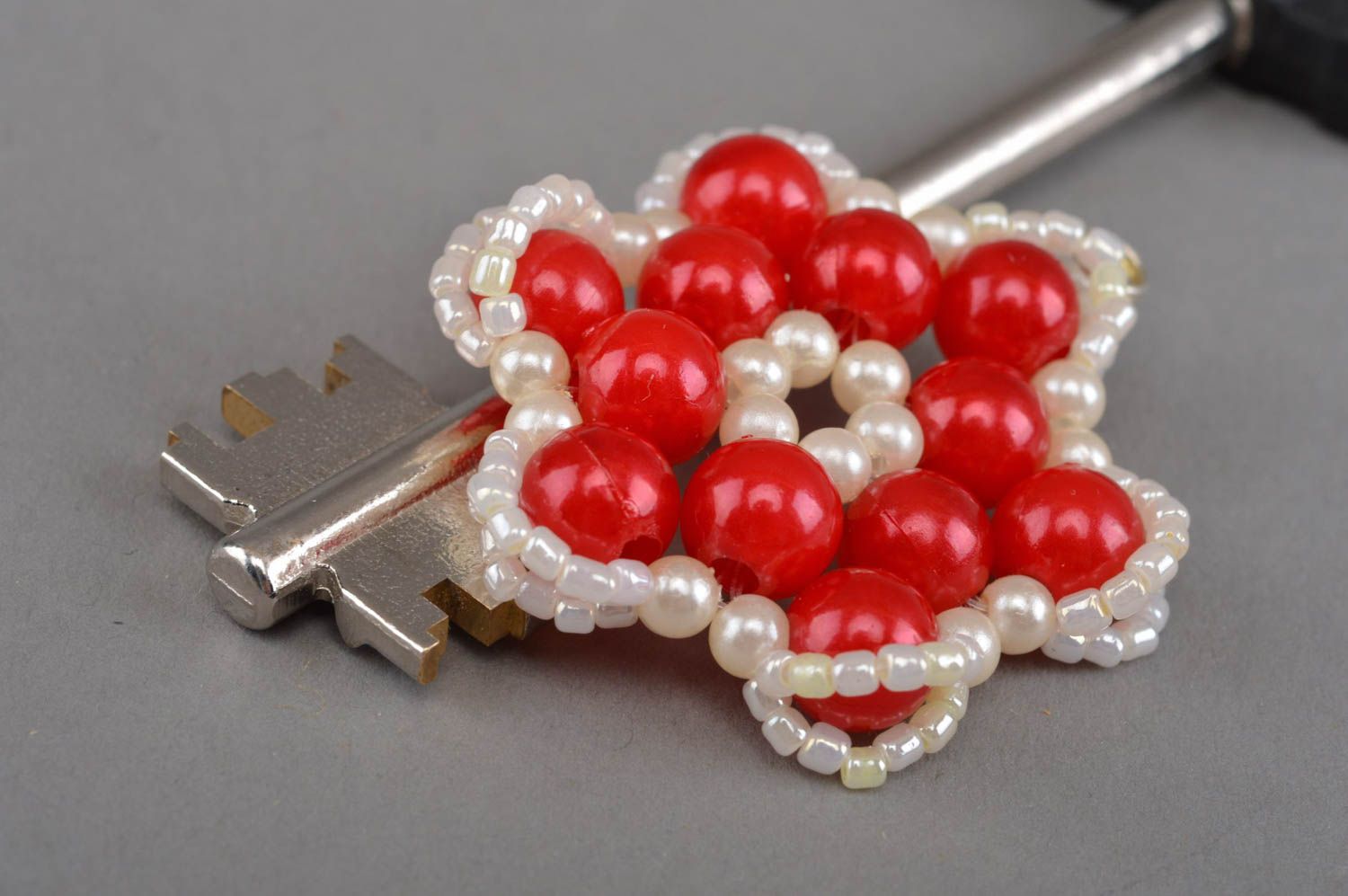 Handmade stylish red keychain braided in the form of a beautiful flower photo 2