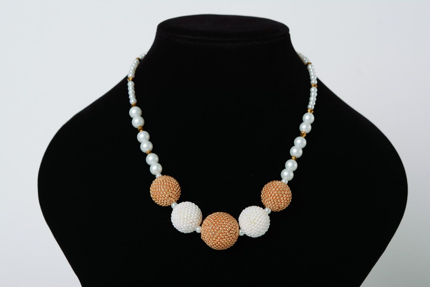 Tender handmade necklace with five balls woven of white and golden beads  photo 1