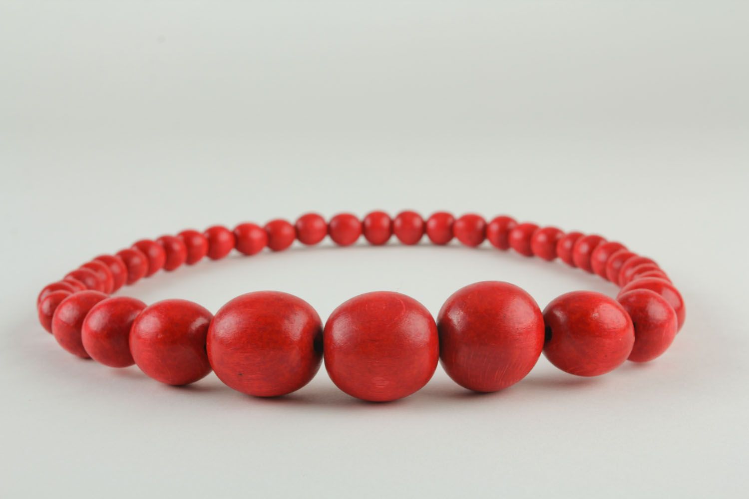 Red necklace made of large beads photo 3