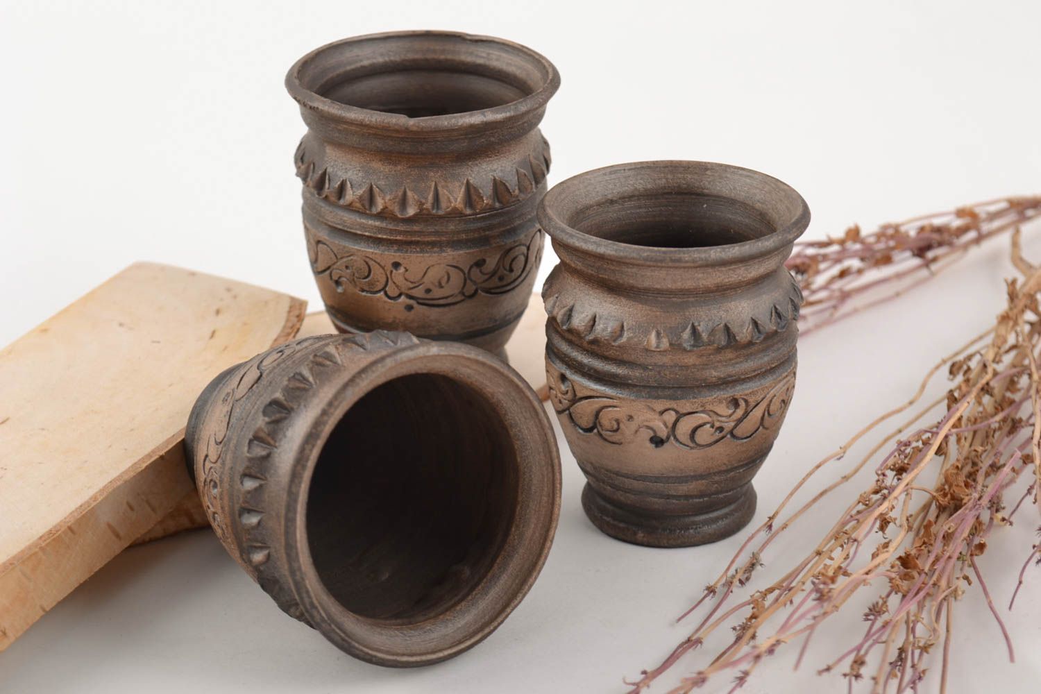 Set of handmade decorative designer ceramic ornamented shot glasses 3 items photo 1