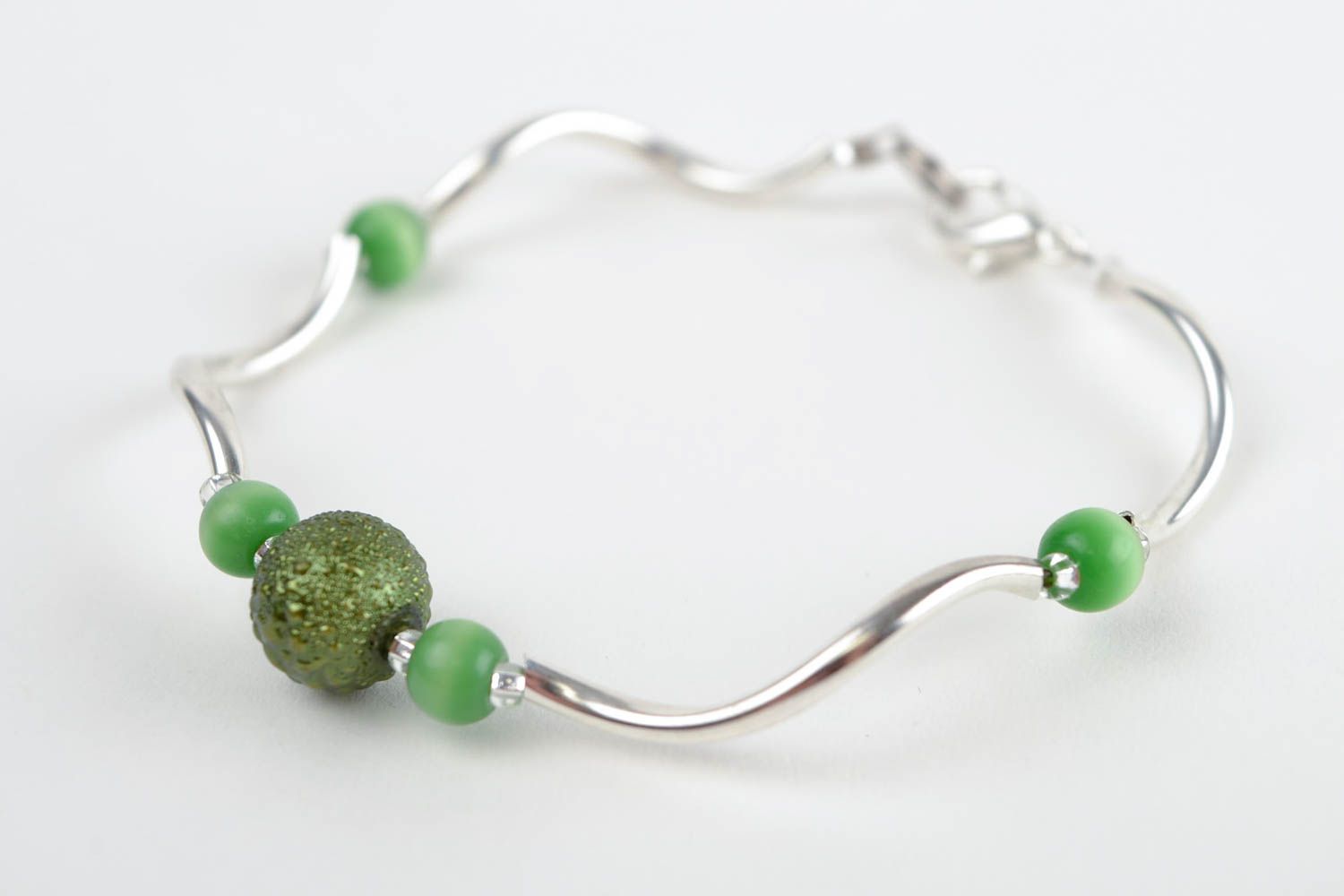Unique elegant metal bracelet with green beads for a young girl photo 1