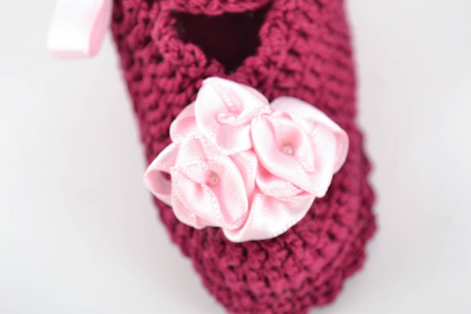 Handmade crocheted lacy baby booties of purple color with pink satin ribbons photo 3