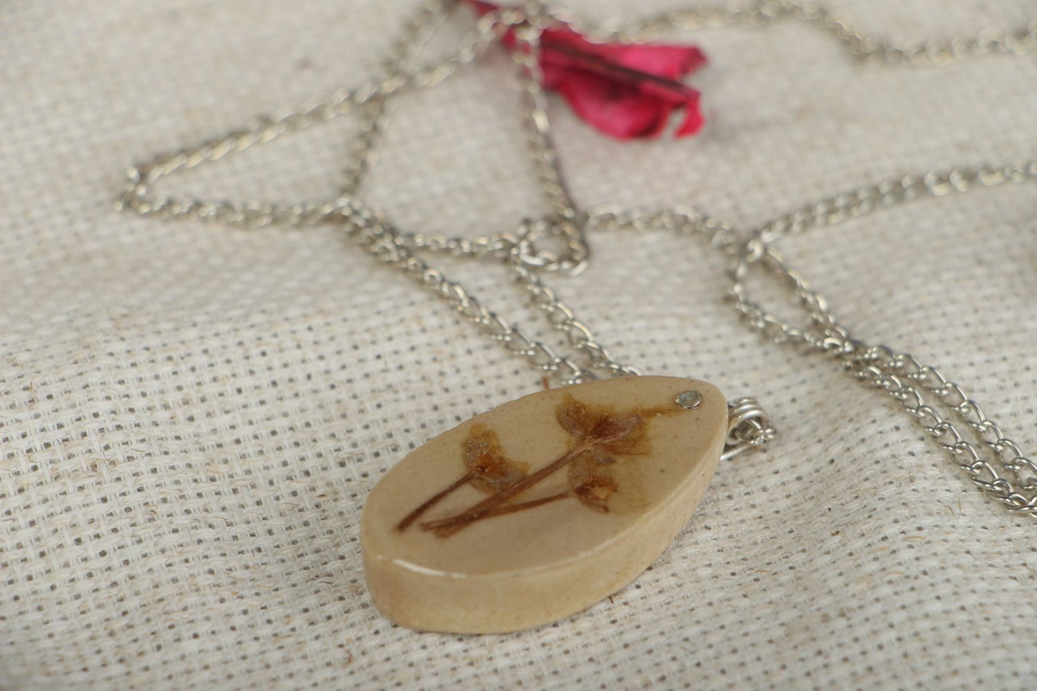 Handmade light oval pendant with flowers embedded in epoxy resin on long chain photo 5