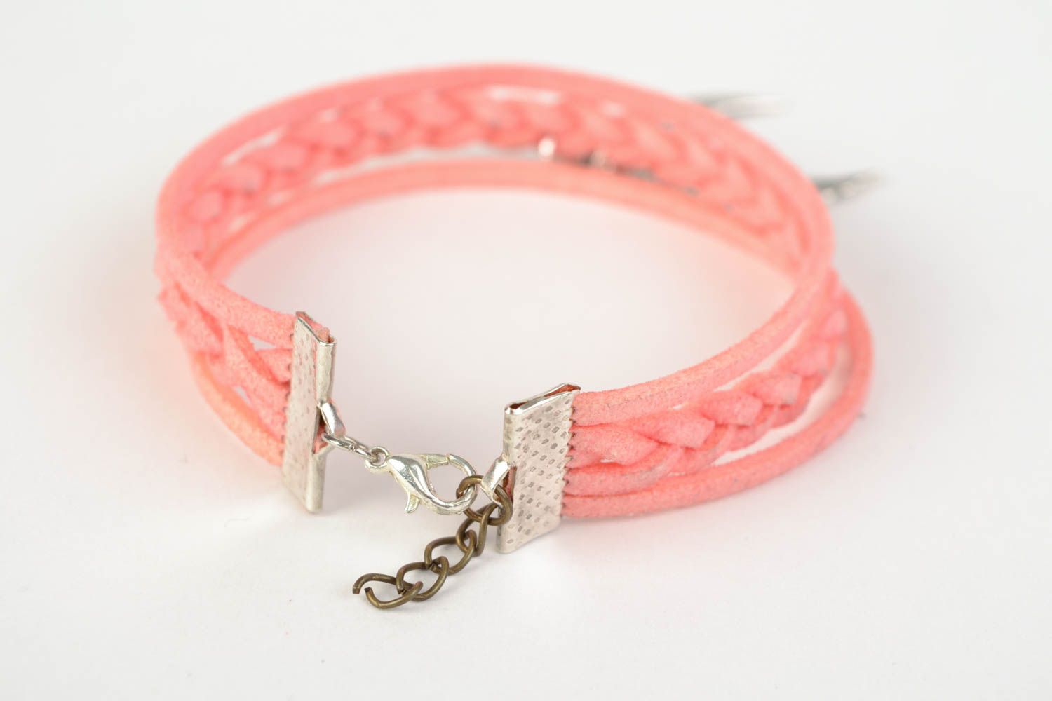 Pink handmade woven suede bracelet with metal charm in the shape of wings photo 4