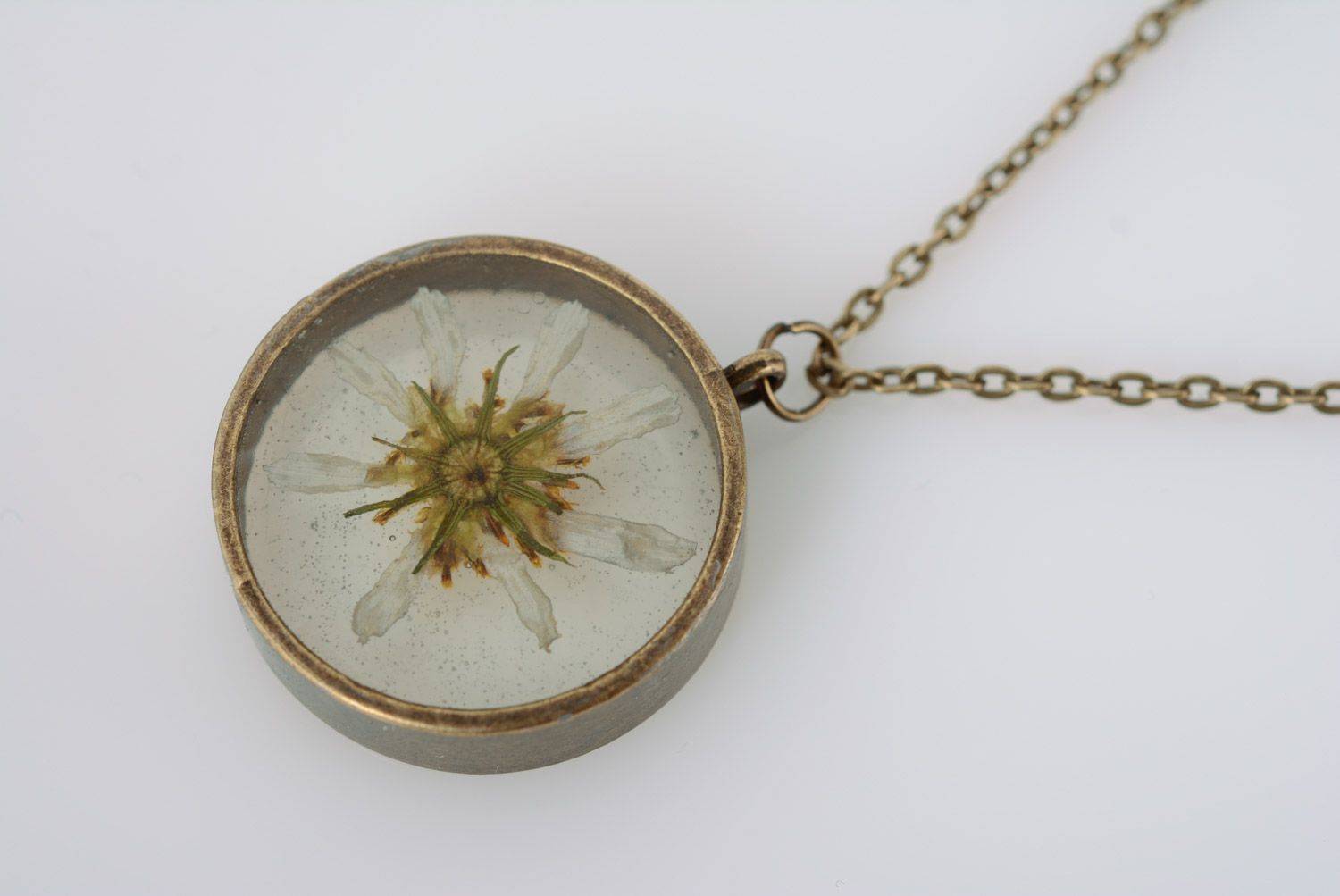 Handmade round transparent pendant with chamomile in epoxy resin on chain photo 2