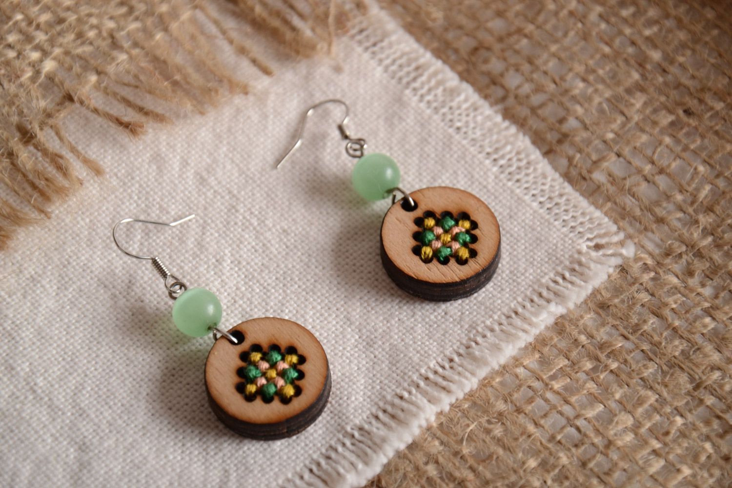 Handmade plywood earrings with cross stitch embroidery and beads in ethnic style photo 1