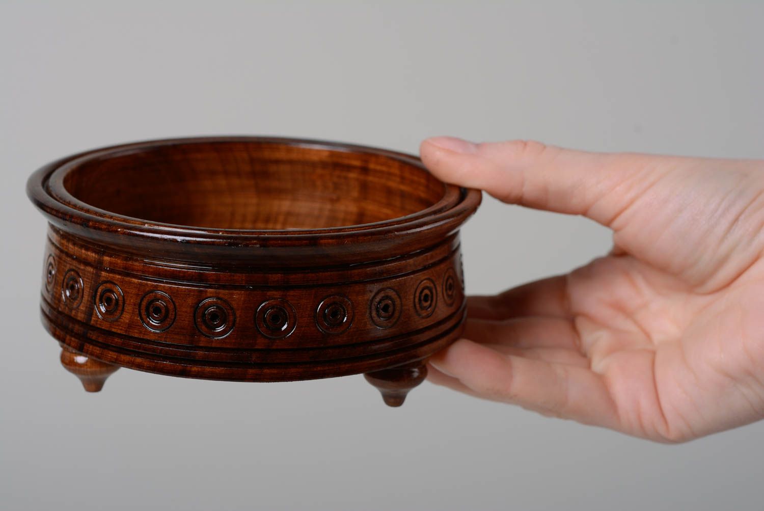 Handmade round varnished wooden candy bowl decorated with carving with legs photo 5