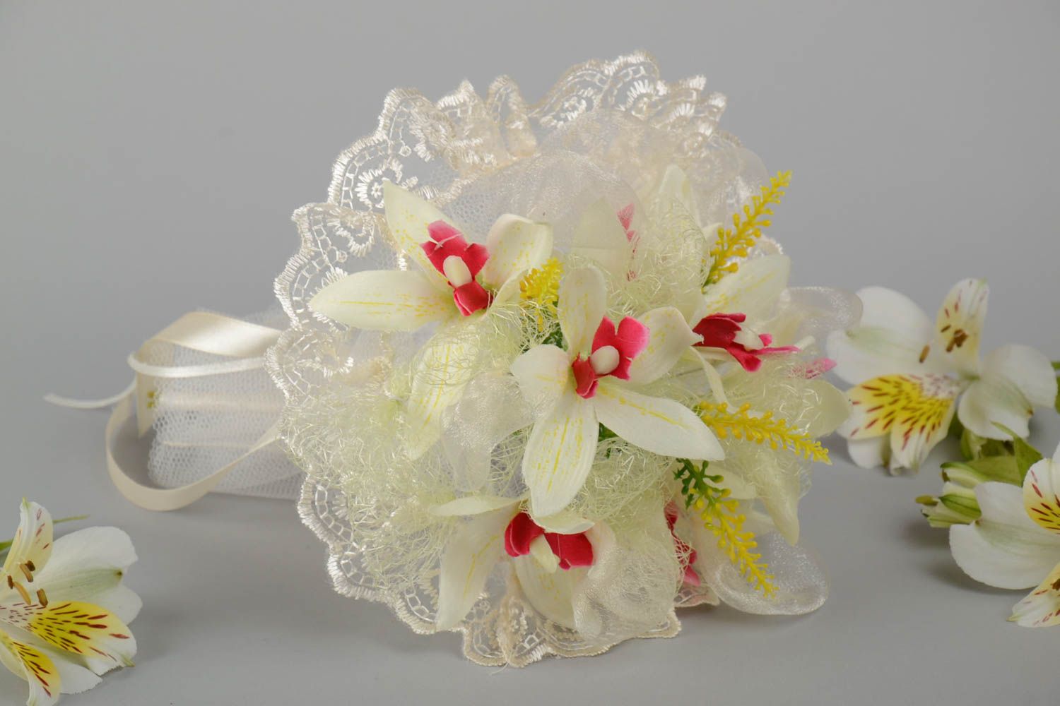 Beautiful wedding bouquet made of handmade artificial flowers with orchids photo 1