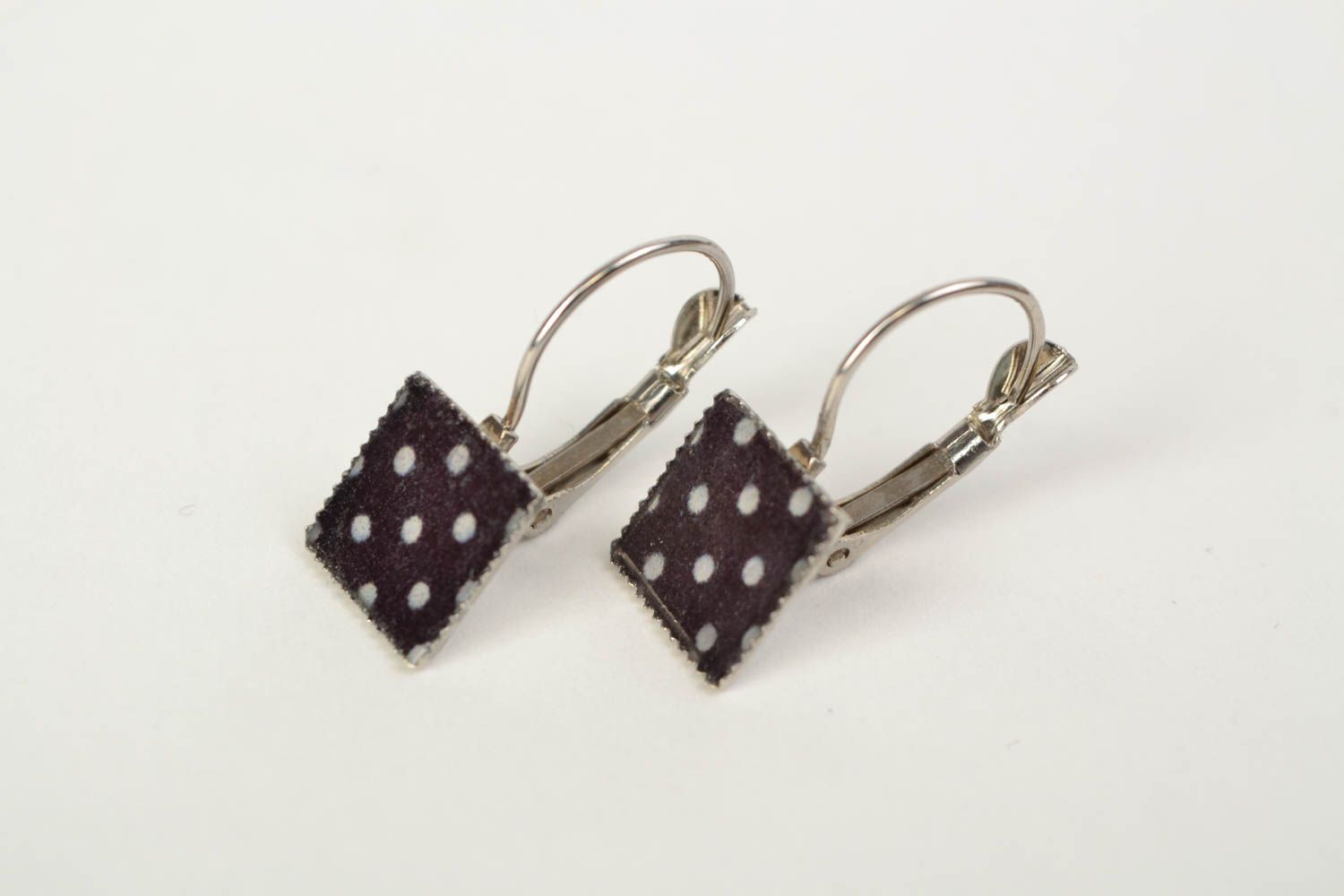 Handmade stylish earrings with jewelry resin of square shape with decoupage black with white photo 1