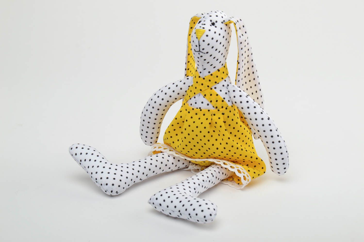 Handmade soft toy sewn of staple fabric rabbit in bright yellow dress with lace photo 3