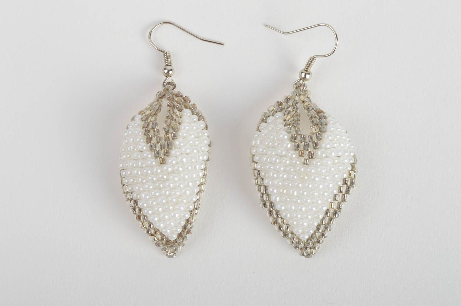 Handmade white and gray beaded woven dangle earrings in the shape of leaves photo 2