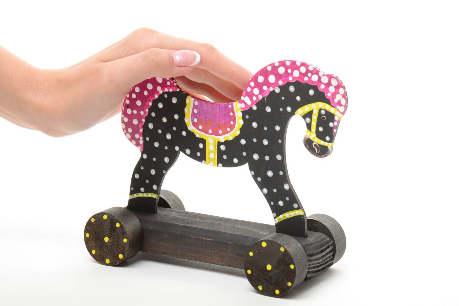 Black and white handmade children's painted wooden wheeled toy horse photo 5