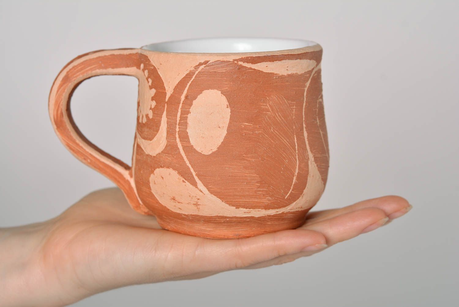 Rustic style clay not glazed cup in light brown and beige colors and handle photo 4
