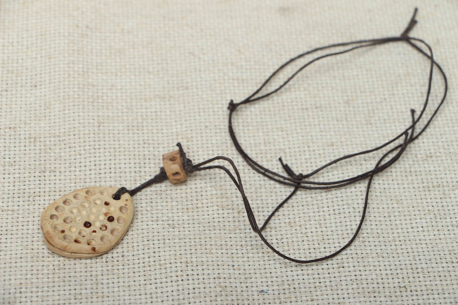 Ceramic pendant with cord photo 1