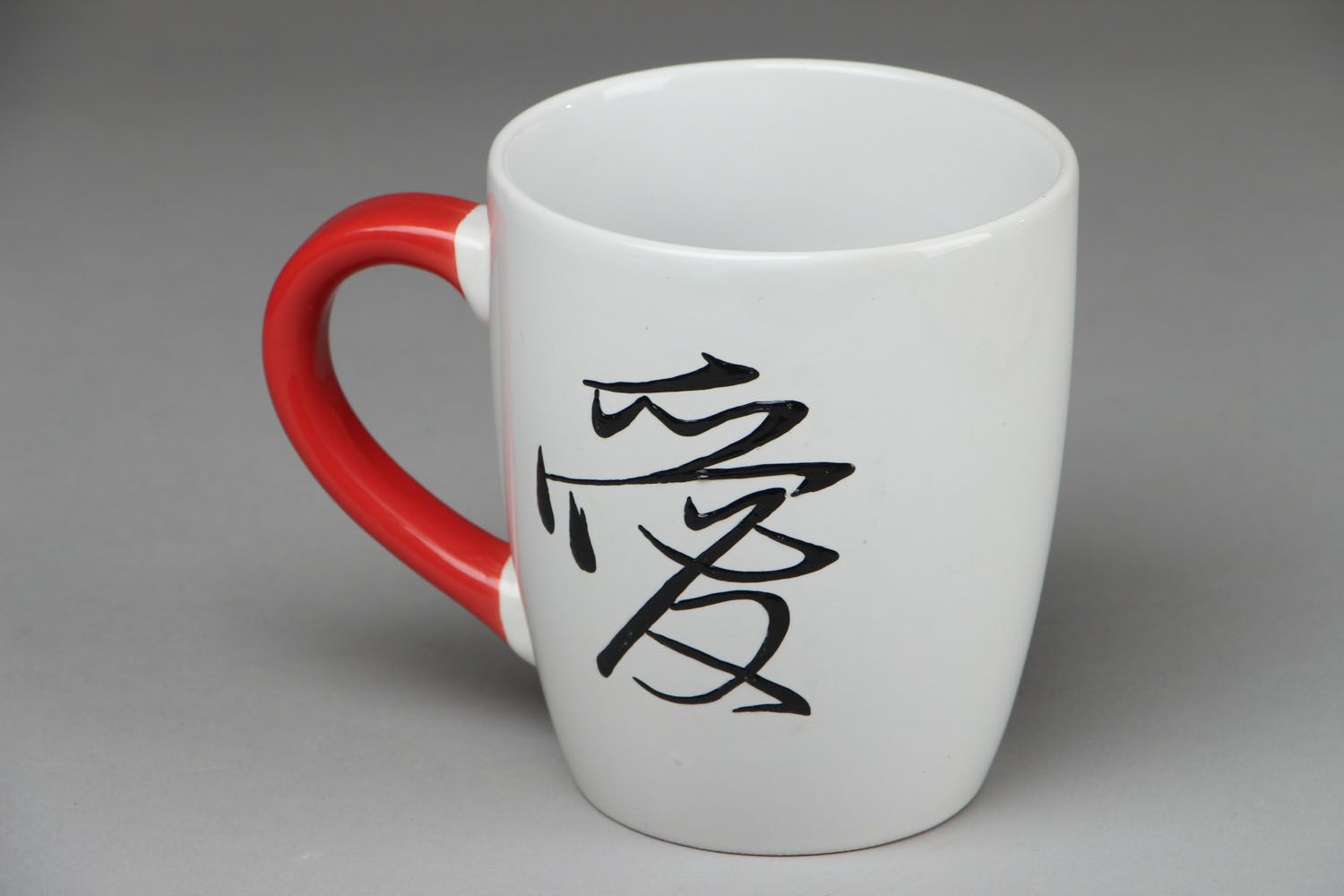 Japanese style white ceramic coffee or tea cup with red handle photo 1