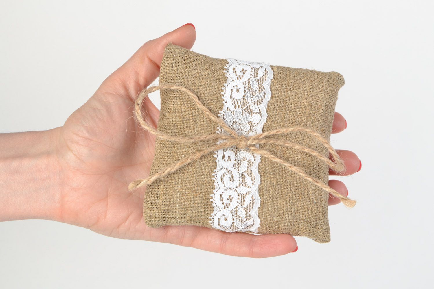 Handmade ethnic rings bearer pillow sewn of burlap with white lace and cord  photo 2