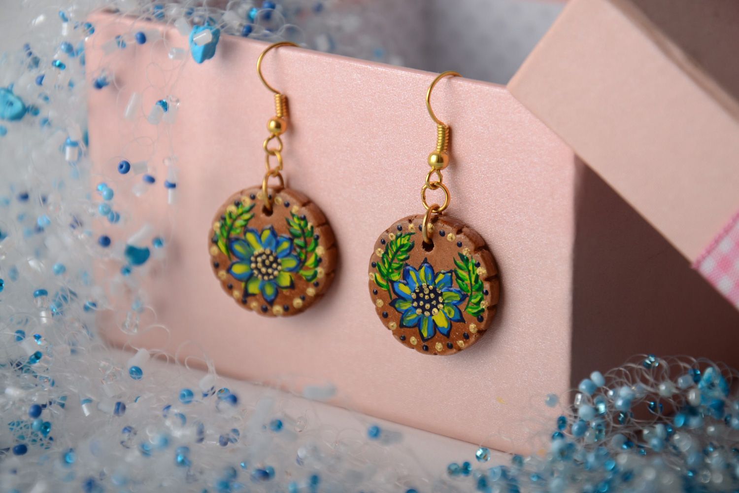 Handmade festive round ceramic earrings painted with acrylics in ethnic style photo 1