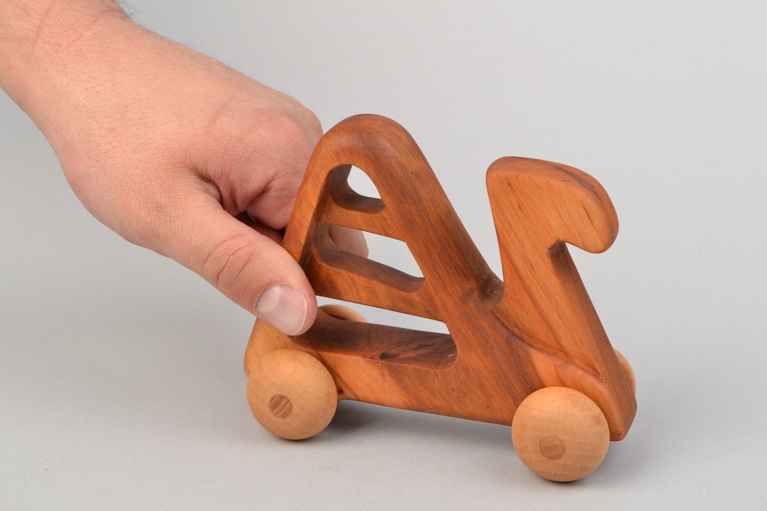 Handmade wooden wheeled toy camel imbued with linseed oil  photo 2