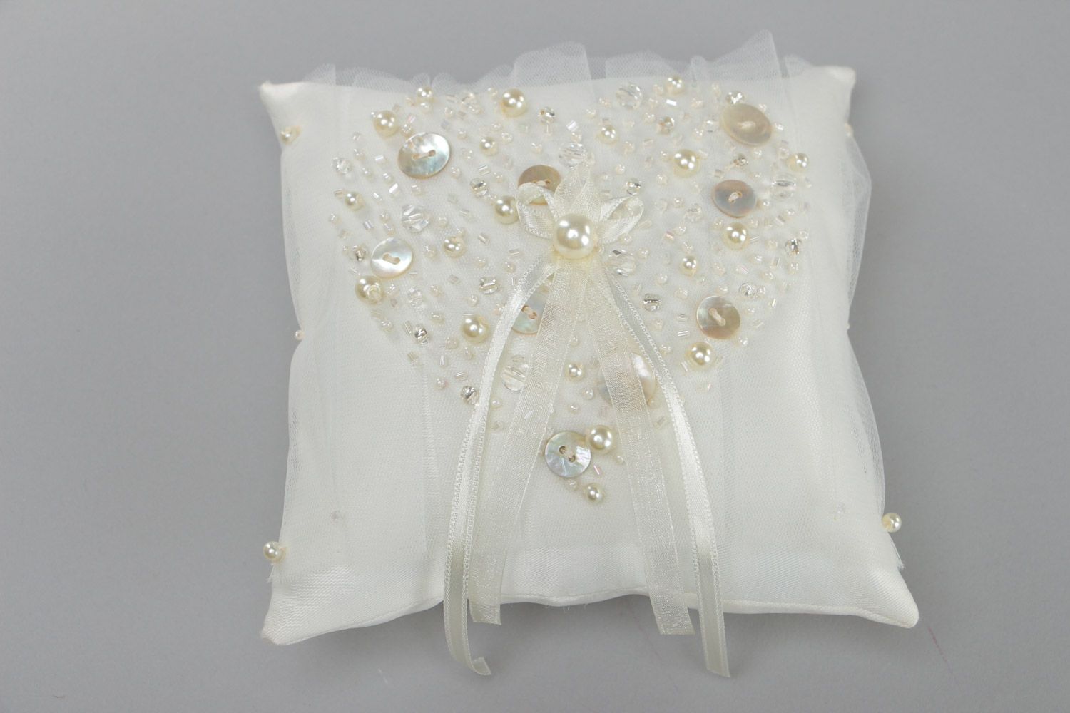 Handmade elegant wedding ring pillow sewn of satin fabric of ivory color photo 2