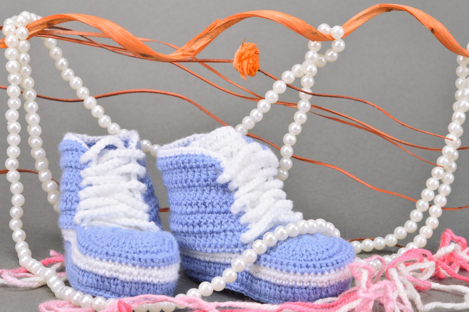 Handmade small crocheted blue baby sneakers with white shoelaces  photo 1