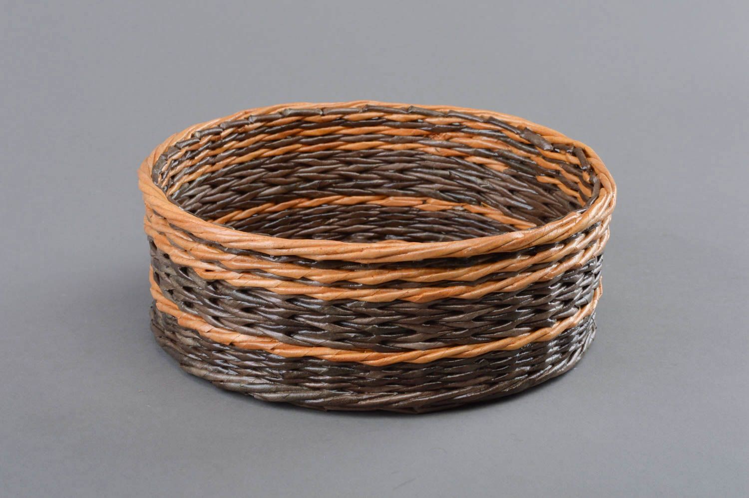 Handmade round brown decorative basket woven of paper rod for interior  photo 2