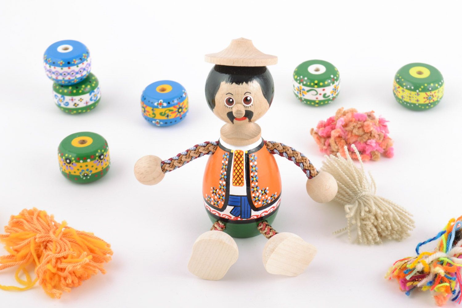 Homemade painted wooden eco toy in the shape of man in Ukrainian costume photo 1