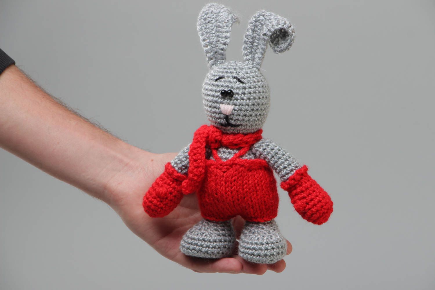 Handmade soft toy gray rabbit crocheted of acrylic threads with red scarf  photo 5